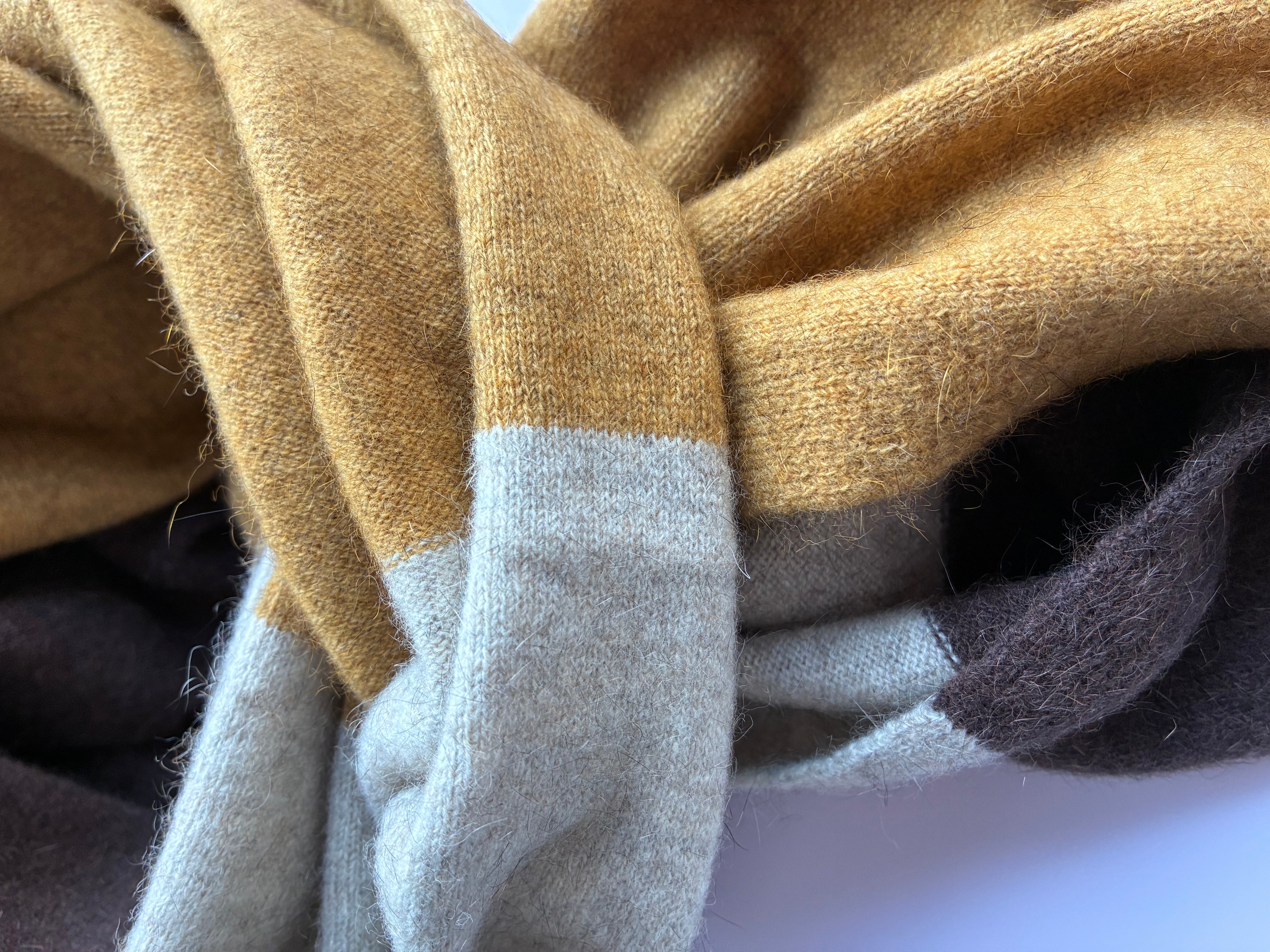 Close-up of brown, gray, and beige fabric swatches.