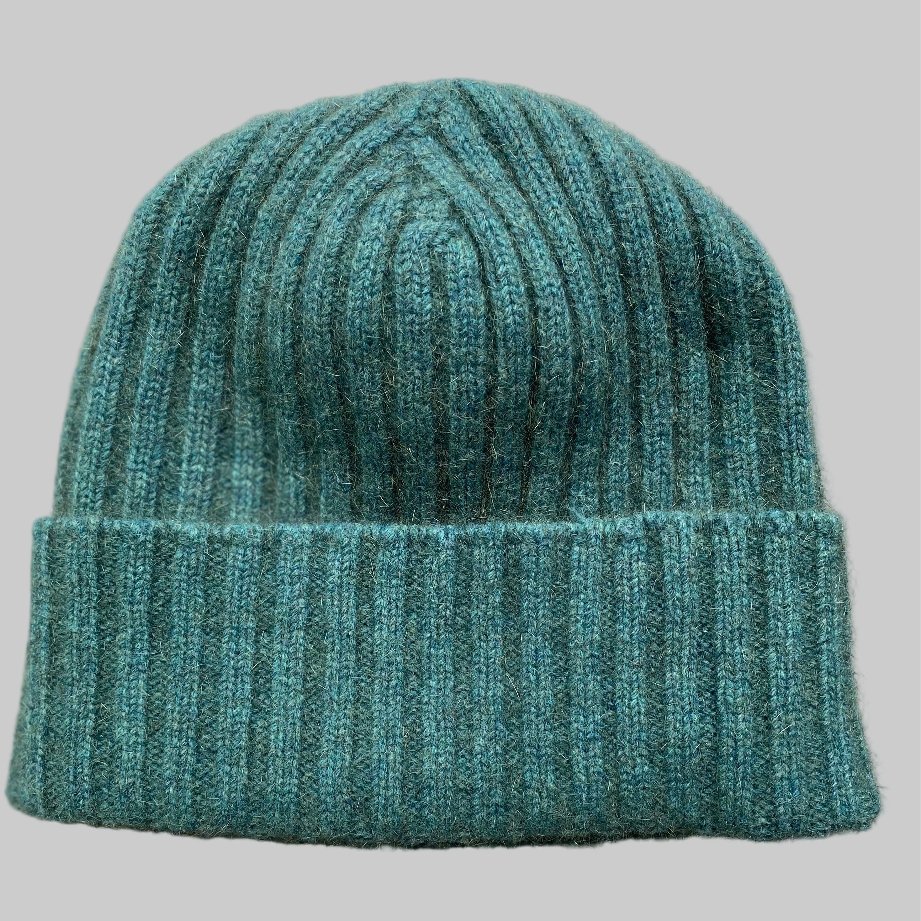 Green Mist merino wool beanie on grey background